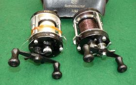 REELS: (2) Abu Ambassadeur 6000C black multiplier reel, 3 screw end plate, foot stamp 740202,