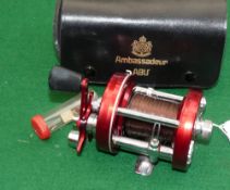 REEL: ABU Ambassadeur 6000 red multiplier reel in as new condition, 3 screw smooth end plate foot