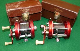 REELS: (2) Abu Ambassadeur 5000 red multiplier reel, 4 screw grooved end plate, foot stamp 159890,