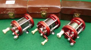 REELS: (3) Set of 3 Abu Ambassadeur 6000 red multiplier reels, early models, non-having foot stamps,