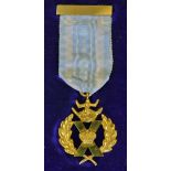 An interesting St Andrews Cross yellow metal medal c/w ribbon and bar, in makers original box Wilson