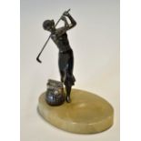 Spelter golfing figure of lady mounted on an oval onyx base ashtray c/w a square mesh golf ball