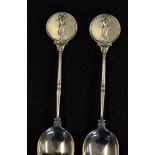 Pair of silver golfing coffee spoons c.1932 - with embossed golfing figure finials