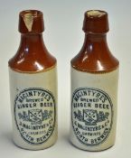 2x McIntyre North Berwick Ginger stone ware bottles - decorated with cross golf clubs and balls