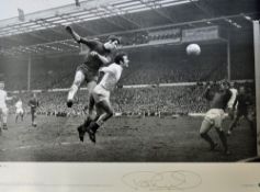 Peter Osgood Signed Chelsea Football Print a black and white print depicting Osgood winning a header