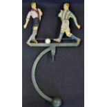 Early Pendulum Metal Football Toy with two players exchange passes as it rocks to and fro on a