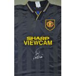 Eric Cantona Signed Manchester United Football Shirt a black away replica shirt, short sleeve,
