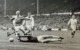 Denis Law Signed Football Print a black and white print depicting Law taking on Banks in the 1963 FA