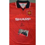 Eric Cantona Signed Manchester United Football Shirt a red short sleeve, replica shirt signed to the