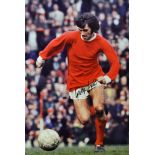 George Best Signed Football Print a colour print depicting Best running with the ball, signed in ink