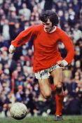 George Best Signed Football Print a colour print depicting Best running with the ball, signed in ink