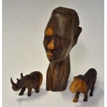 3x East African Hardwood Carvings to include a small male head, miniature Lion and Rhino