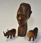 3x East African Hardwood Carvings to include a small male head, miniature Lion and Rhino