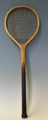 Interesting Small Round Head Wooden Racket a long thin handled racket with leather butt cap,