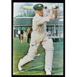 Don Bradman Signed Cricket Print signed to the front in ink, depicts a batting posed Bradman, in