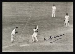 Don Bradman Signed Cricket Photograph a black and white press photograph, stamped to the reverse,