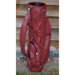 A good leather modern golf bag c/w replaced padded shoulder strap and various pockets.