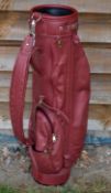 A good leather modern golf bag c/w replaced padded shoulder strap and various pockets.