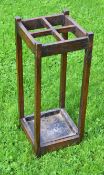 Large dark stained oak umbrella display stand c/w metal tray - divided into 4x sections and ideal
