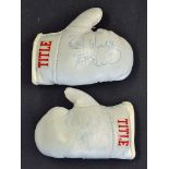 Frank Bruno Signed Miniature Boxing Gloves a pair of miniature boxing gloves in white, signed in ink