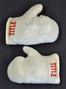 Frank Bruno Signed Miniature Boxing Gloves a pair of miniature boxing gloves in white, signed in ink