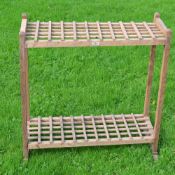 Interesting light oak stand divided into 55 sections top and bottom ideal for displaying golf