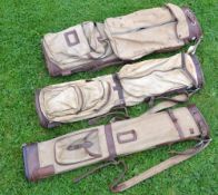 3x various canvas and leather oval golf bags, 2 with travel hoods, all with shoulder straps