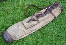 A useful canvas and leather golf bag c/w ball pocket, shoulder strap and travel hood
