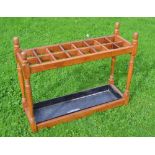 Large oak umbrella stand c/w steel tray divided into 18 sections ideal for displaying gold clubs -