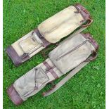 2x good canvas and leather oval golf bags - both c/w travel hoods, original shoulder straps and