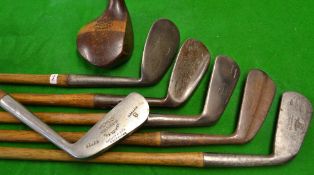A graded set of 7x hickory golf clubs to incl 5x irons - a driving iron, an iron, mashie, m/