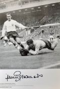 Jimmy Greaves Signed England Football print depicting former Russian goalkeeper diving at Jimmy's