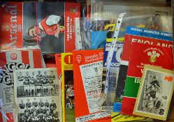 Box of football Ephemera includes various football programmes some International, Arsenal,