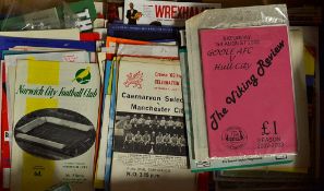 A box of football programmes with friendlies, testimonial and charity matches represented together