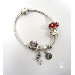 PANDORA SILVER CHARM BRACELET with heart clasp and various charms including Minnie Mouse and a