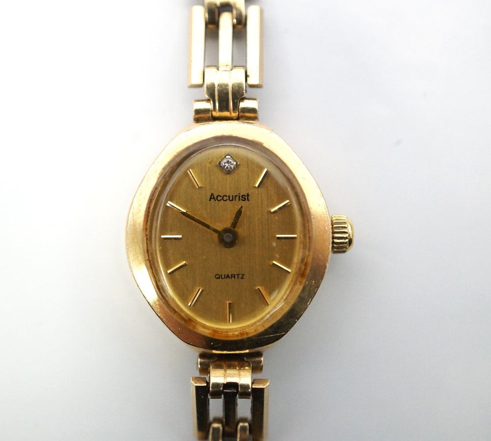 LADY'S 9CT GOLD ACCURIST COCKTAIL WATCH bearing the Swiss standard mark,