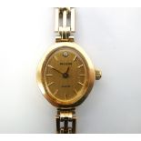 LADY'S 9CT GOLD ACCURIST COCKTAIL WATCH bearing the Swiss standard mark,