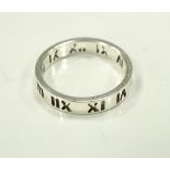 TIFFANY & CO SILVER ATLAS RING with pierced Roman numeral decoration,