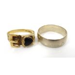 TWO NINE CARAT GOLD RINGS comprising a buckle ring with black enamel heart decoration and pierced
