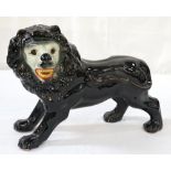 LARGE STAFFORDSHIRE POTTERY LION with glass eyes,