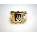 GENTLEMAN'S NINE CARAT GOLD MASONIC SWIVEL RING the black enamel decorated panel decorated with