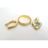 BLUE TOPAZ SET HEART SHAPED PENDANT in fourteen carat gold;