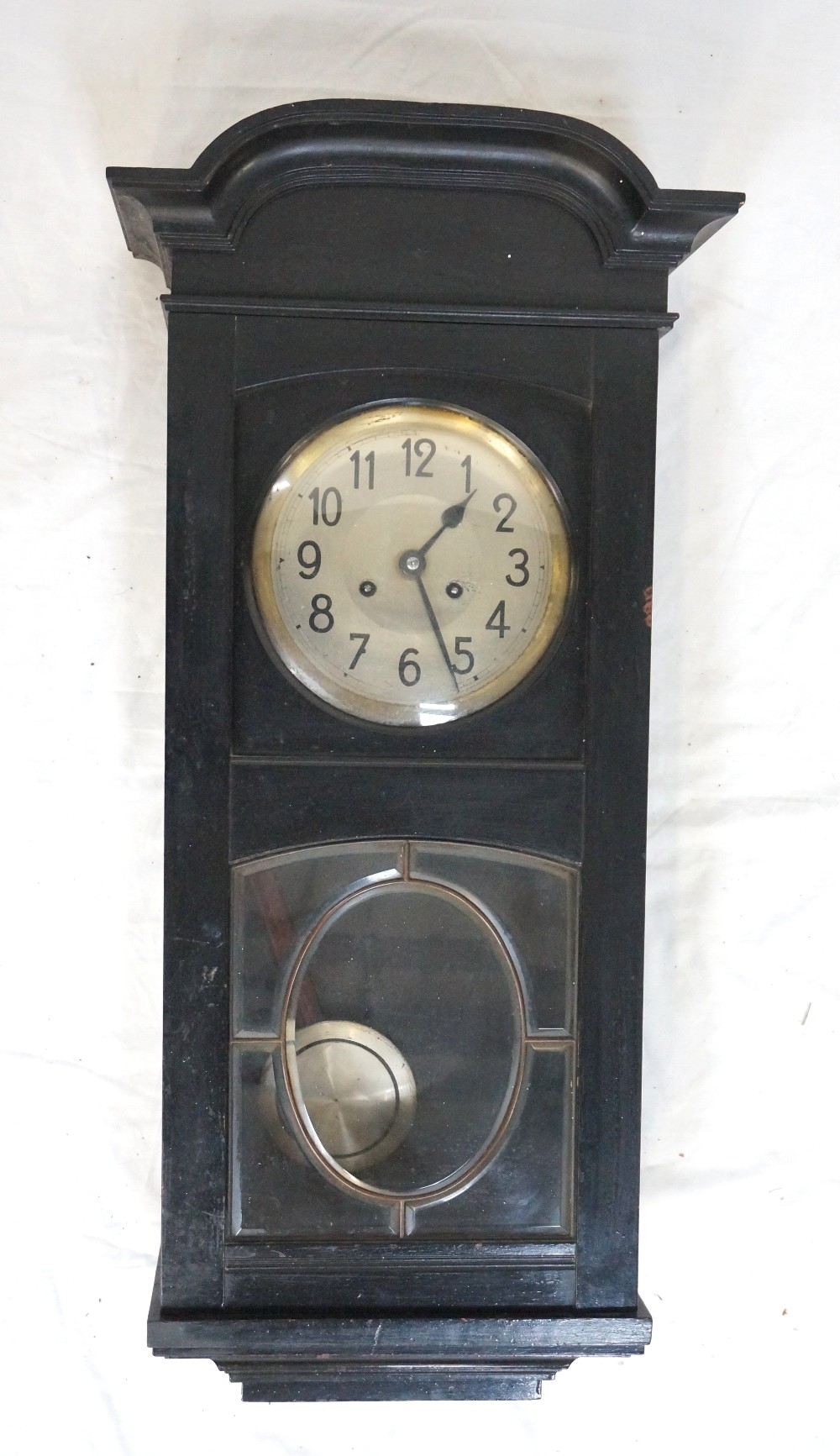 EARLY 20th CENTURY WALL CLOCK in an ebonised case with a circular silvered dial with Arabic