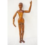 19th CENTURY CONTINENTAL PINE ARTIST'S LAY with a carved face and articulated joints,