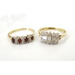 TWO NINE CARAT GOLD CLUSTER RINGS one set with garnet and clear gem stones and the other with CZ,