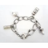 DKNY CHARM BRACELET with a selection of charms including a New York taxi and a stiletto sandal