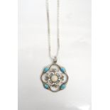 CONTINENTAL OPAL AND TURQUOISE ENAMEL DECORATED SILVER PENDANT with pierced scroll decoration,