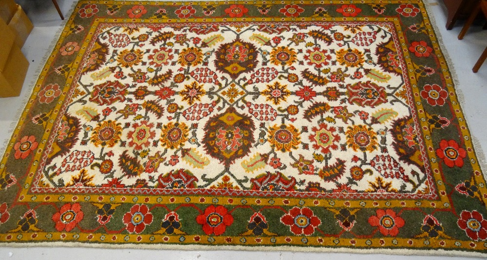 LARGE EASTERN RUG with a floral green,