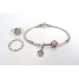 PANDORA MOMENTS SILVER CHARM BRACELET with two charms;