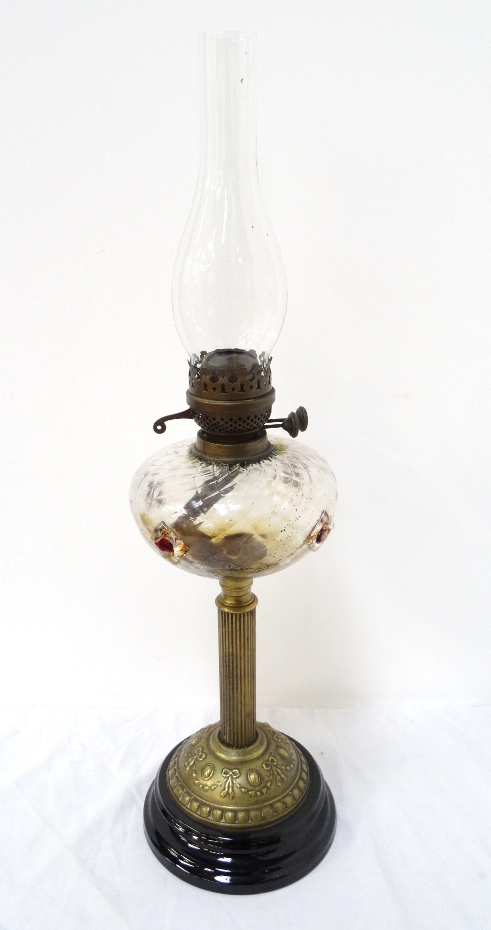 VICTORIAN BRASS COLUMN OIL LAMP with glass bowl and flute, raised on circular base,